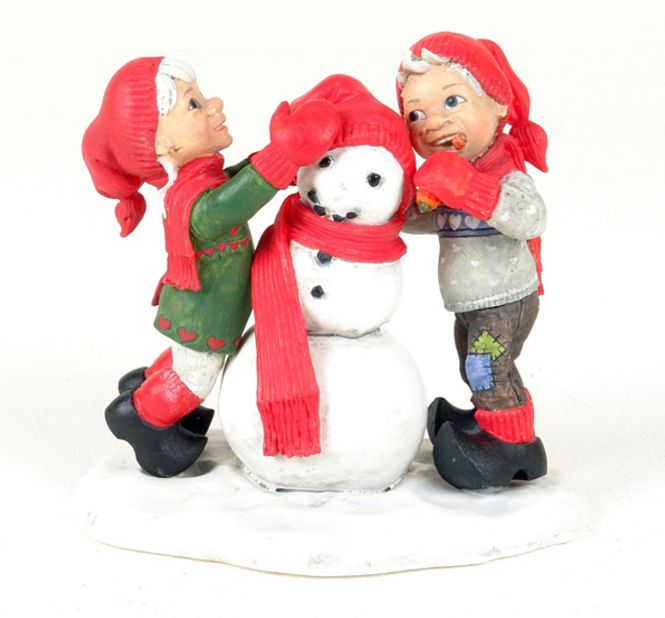 Main Image Girl and boy making snowman